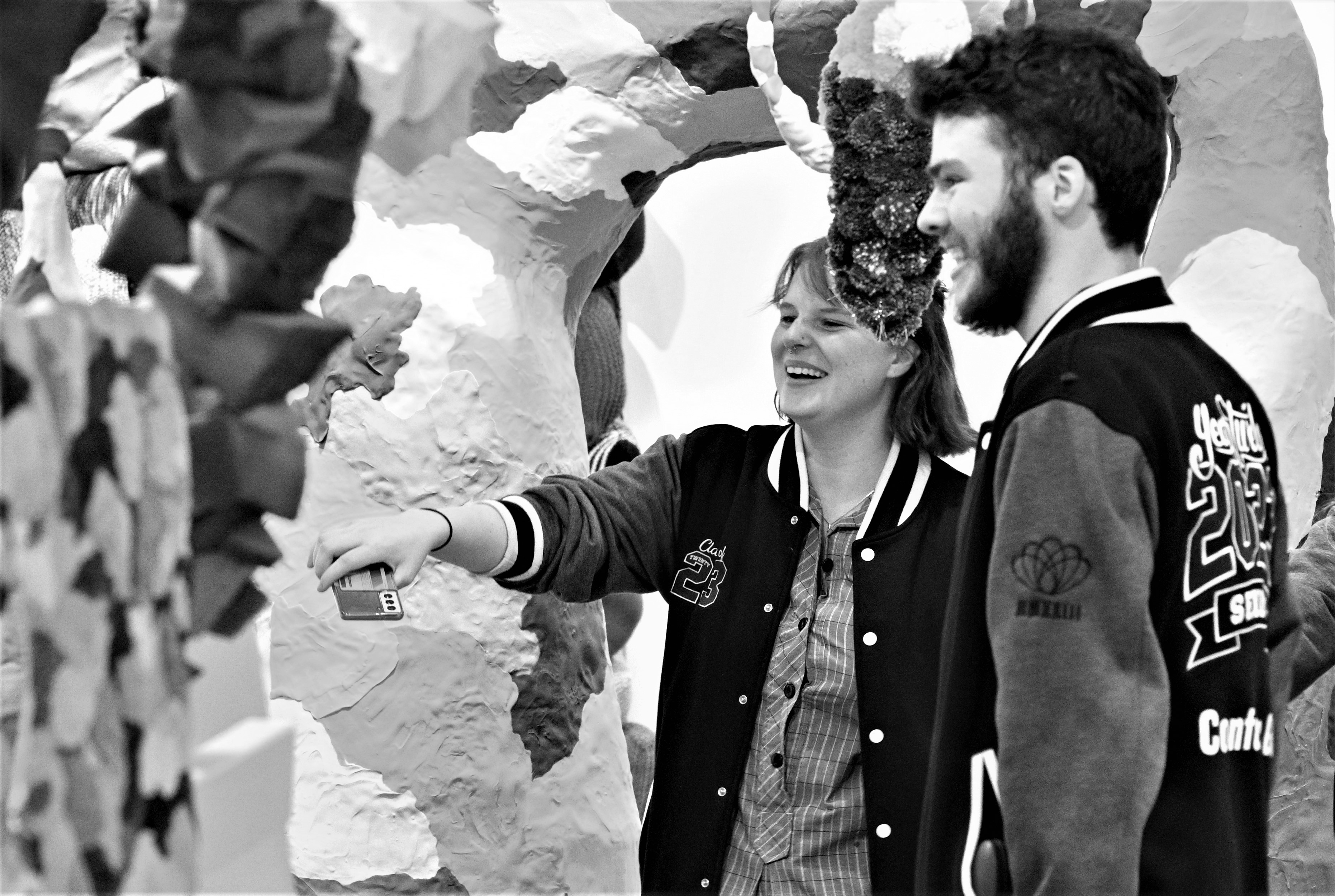 two year 12 students looking at an art installation