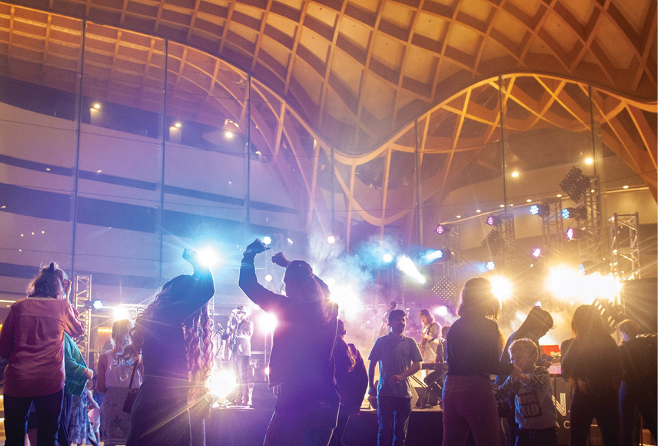 People dancing in lights outside Bunjil Place