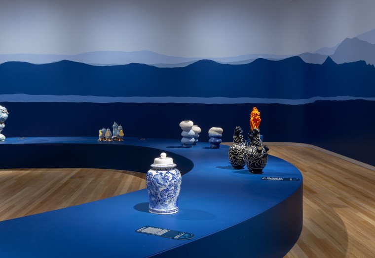 Clay pots on display in a gallery. 