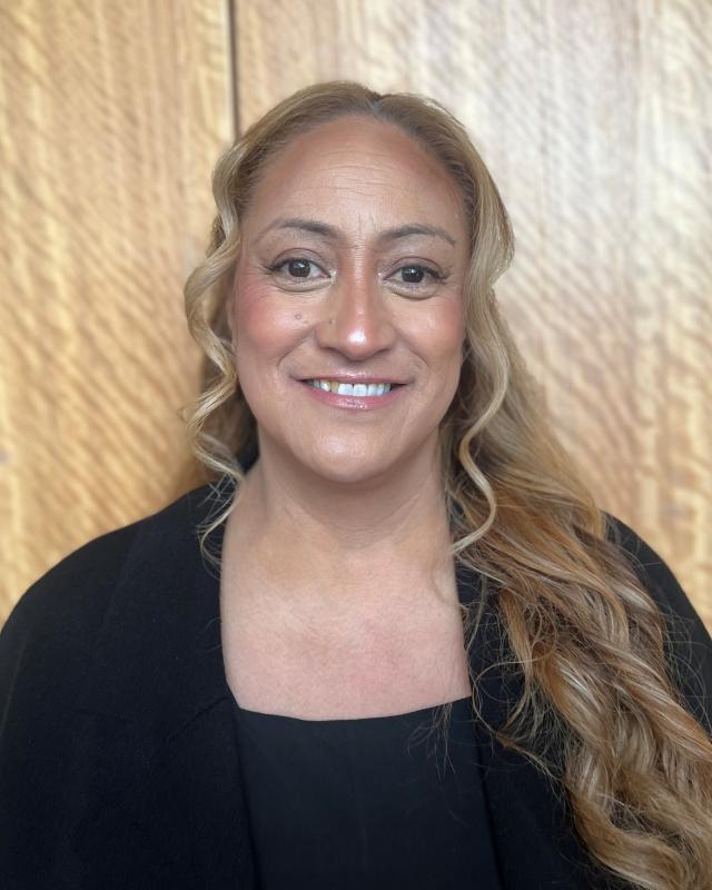 Woman with long hair and a black dress