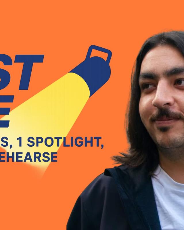 A man with long dark hair and a white t-shirt under a black jacket, with the words Fast Five beside his head